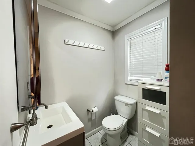 a bathroom with a sink toilet and vanity