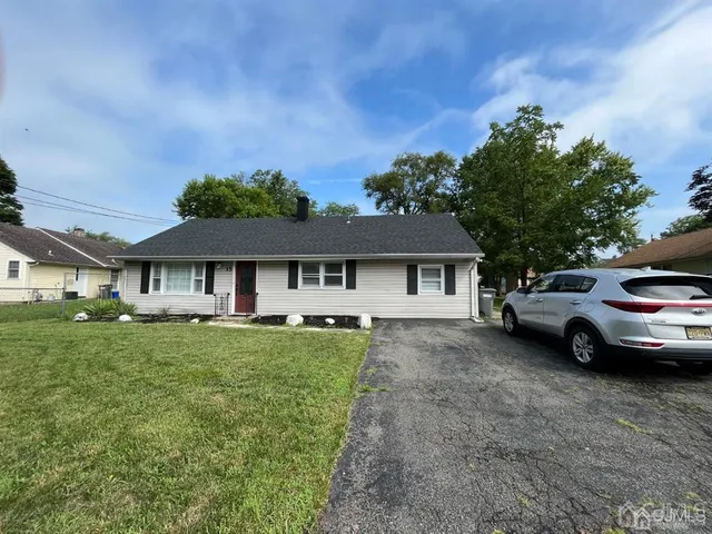 a view of a car parked in front of a house