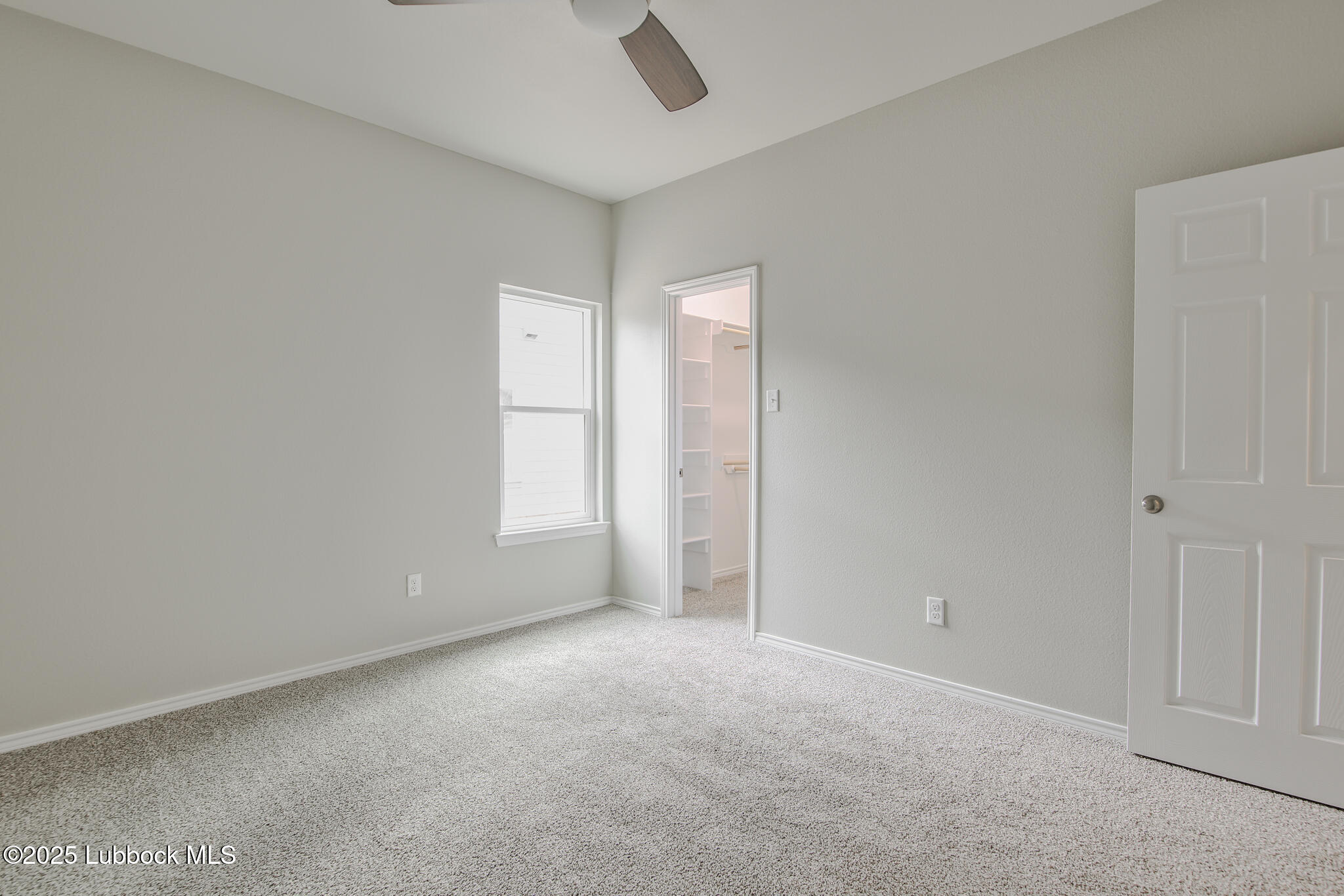 3117 74th Street Lubbock, TX 79423 - Photo 18 of 36 a view of an empty room and window