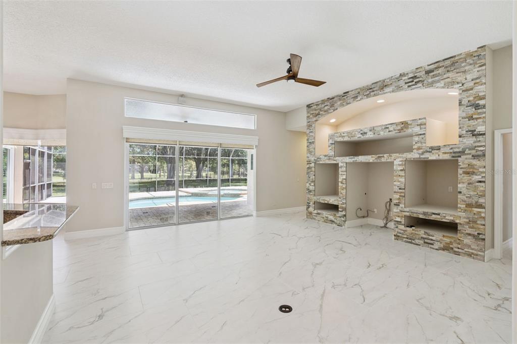 2230 Ridgewind Way Windermere, FL 34786 - Photo 10 of 38 a big room with chandelier fan and windows