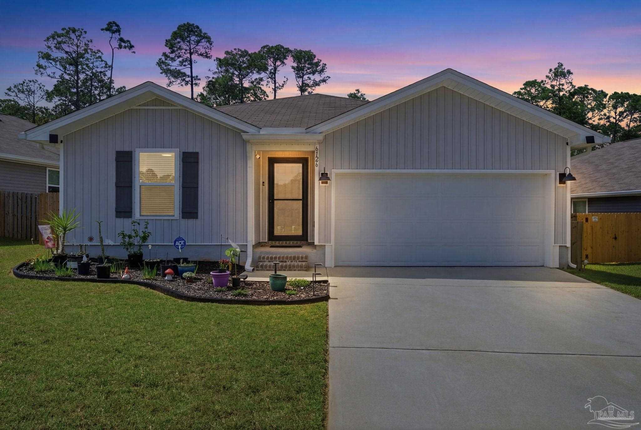 a front view of house with yard outdoor seating and entertaining space