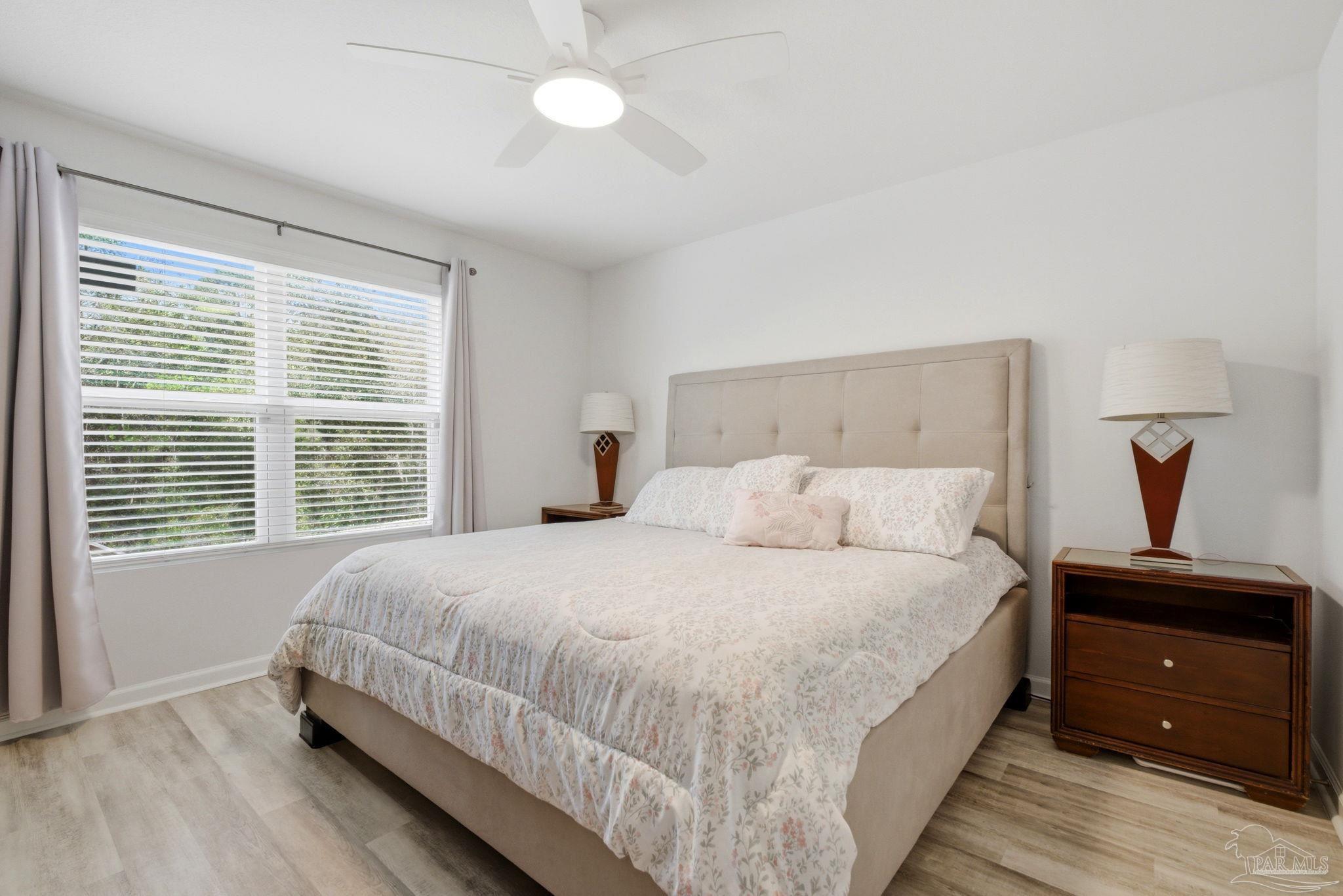 6126 Native Dancer Way Pensacola, FL 32526 - Photo 12 of 40 a bedroom with a bed and a window