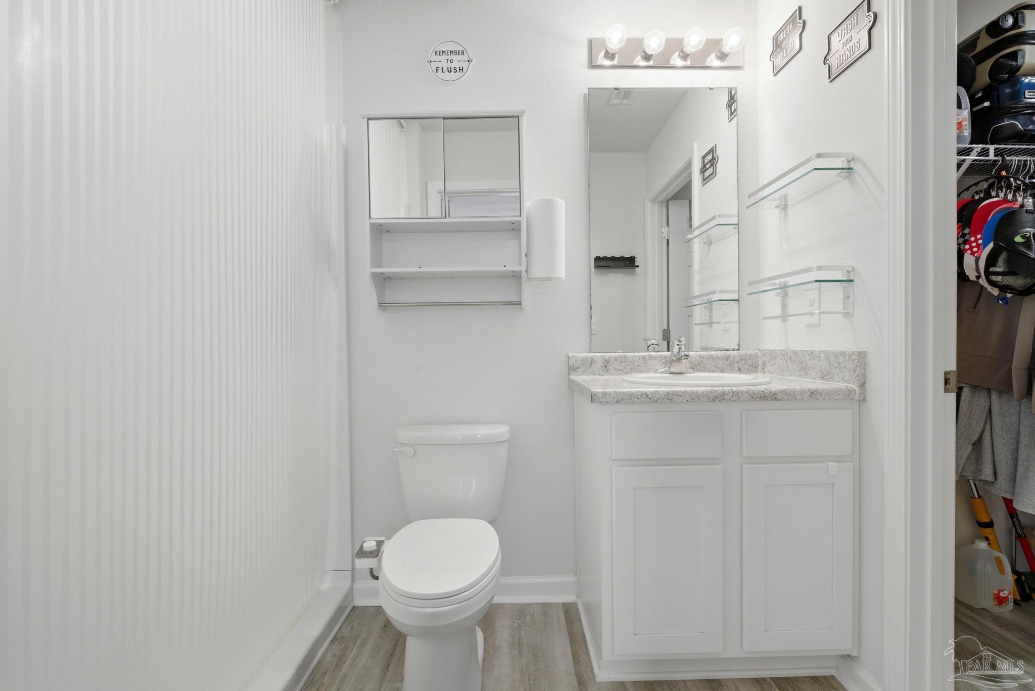 6126 Native Dancer Way Pensacola, FL 32526 - Photo 15 of 40 a bathroom with a sink toilet and shower