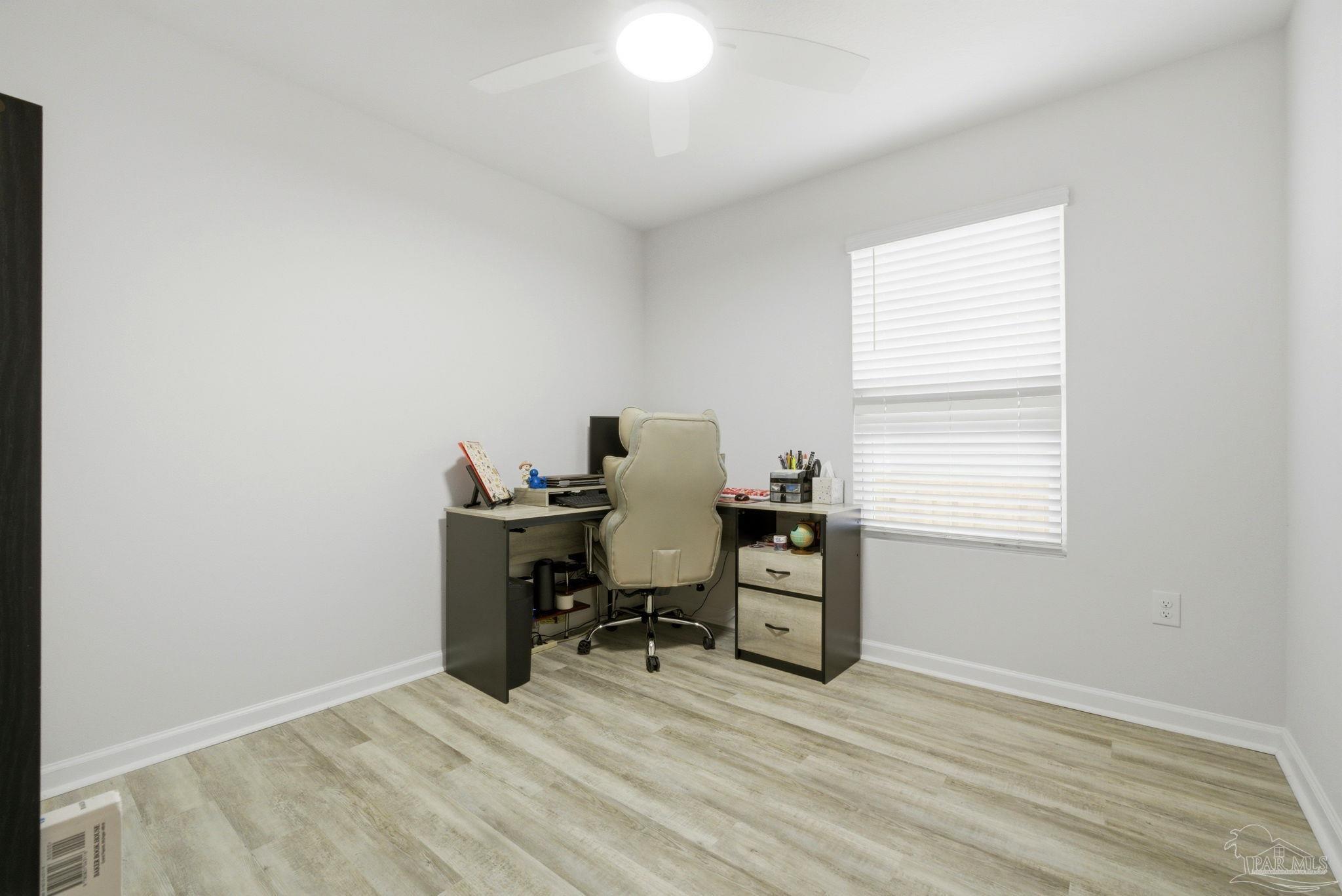 6126 Native Dancer Way Pensacola, FL 32526 - Photo 19 of 40 a view of a workspace with furniture and a window