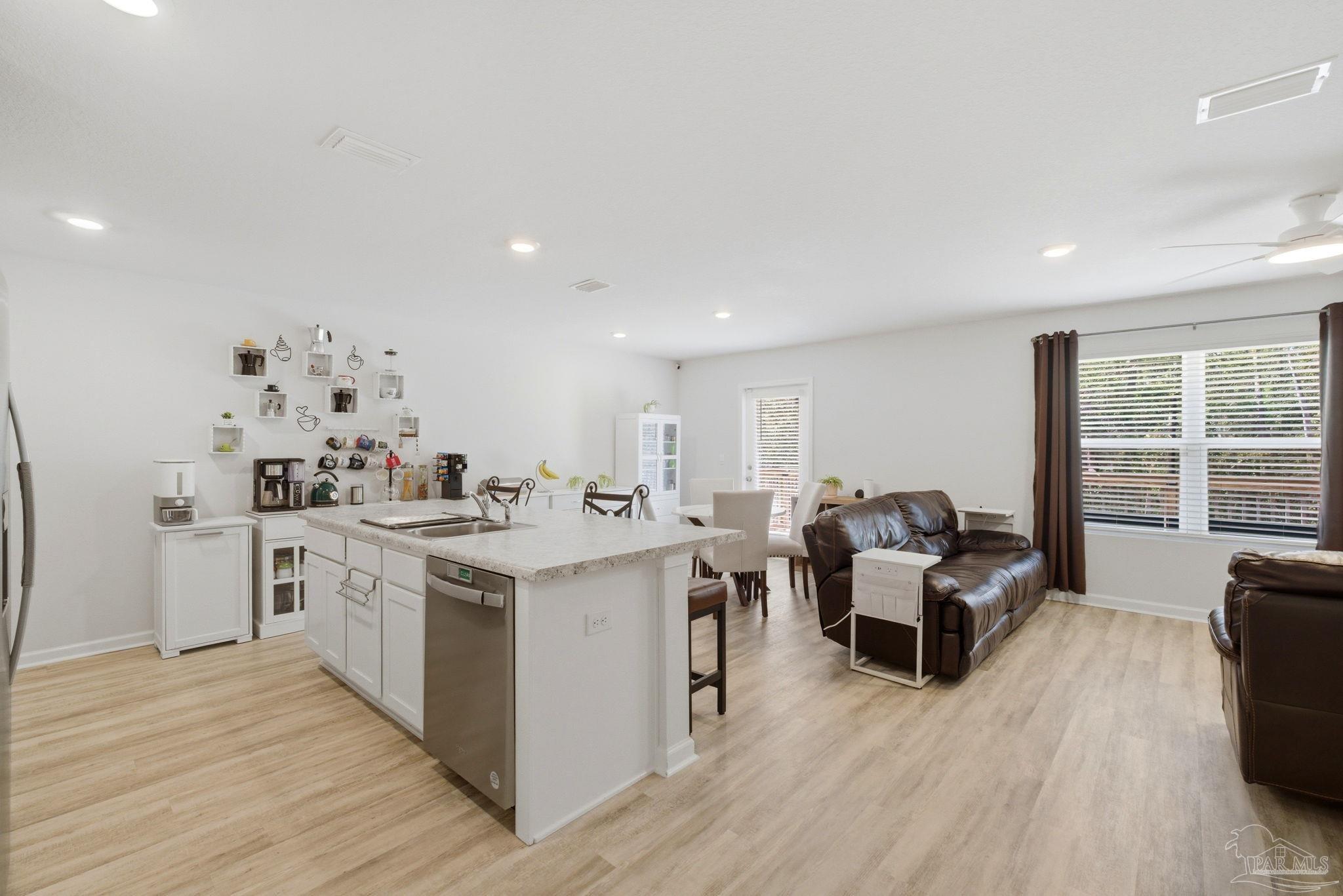 6126 Native Dancer Way Pensacola, FL 32526 - Photo 28 of 40 a living room with furniture and a large window