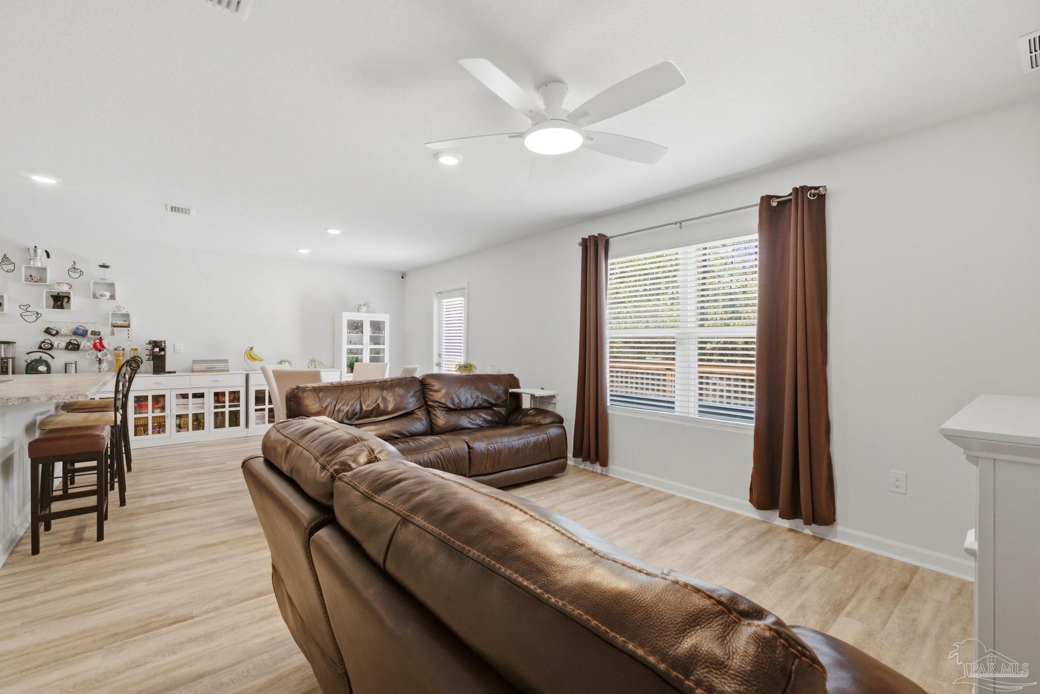 6126 Native Dancer Way Pensacola, FL 32526 - Photo 30 of 40 a living room with furniture and a window