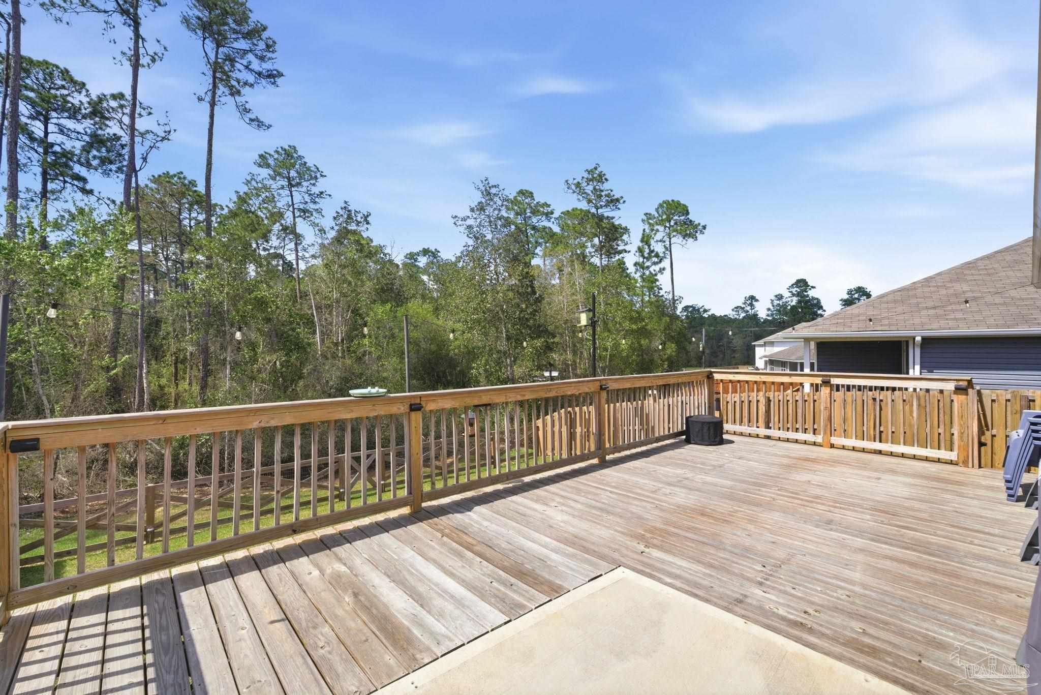 6126 Native Dancer Way Pensacola, FL 32526 - Photo 33 of 40 a balcony with wooden floor and fence