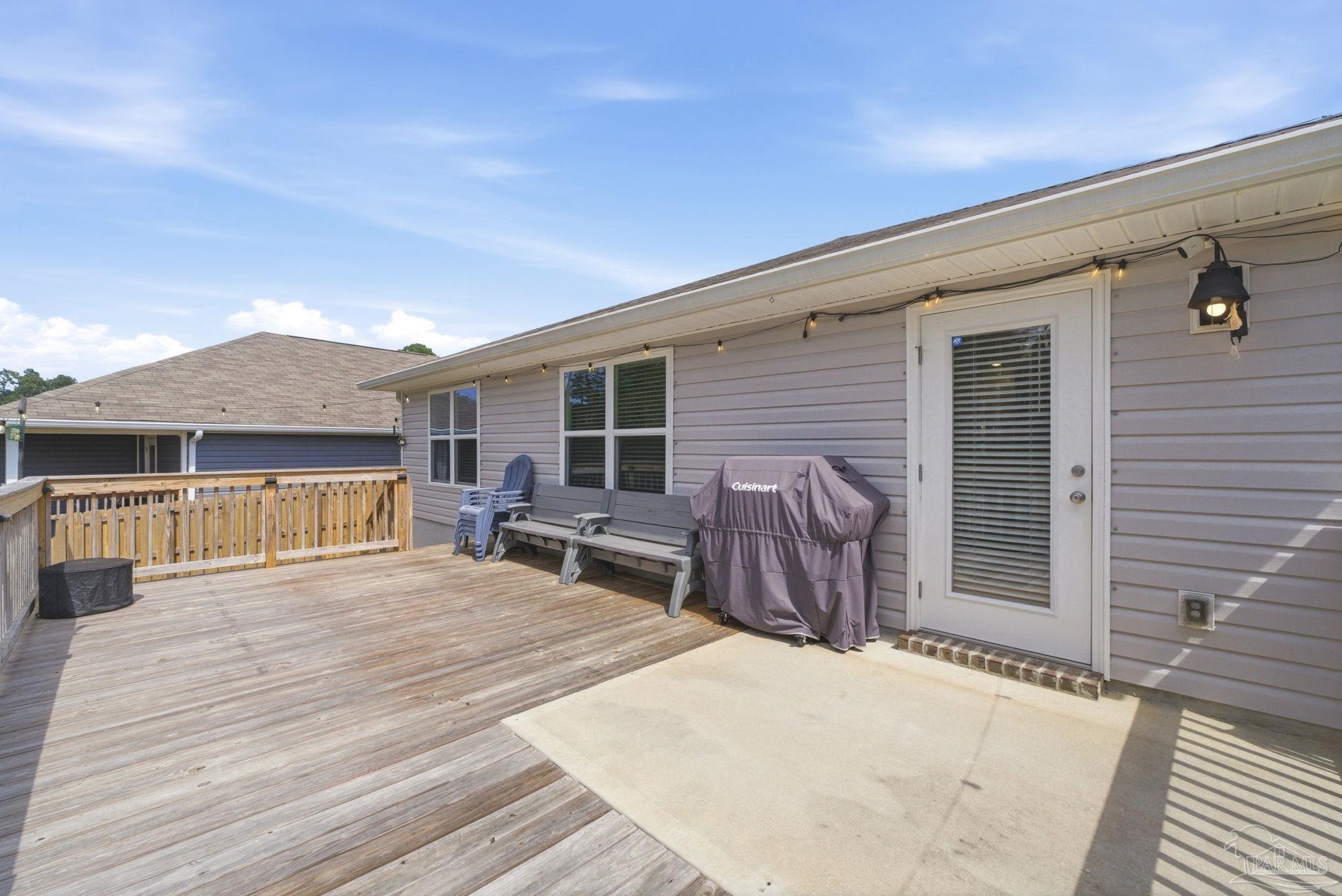 6126 Native Dancer Way Pensacola, FL 32526 - Photo 34 of 40 a backyard of a house with table and chairs