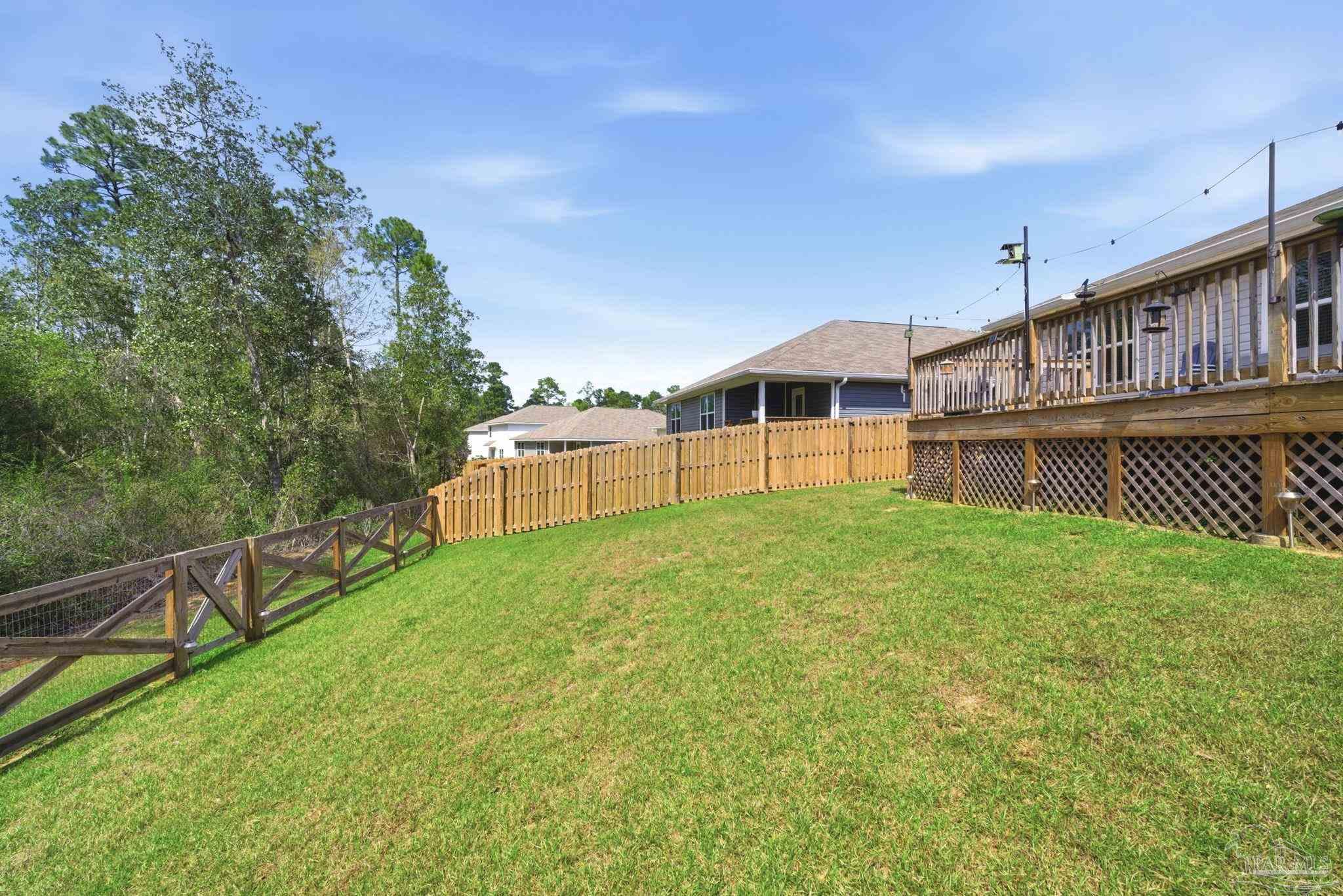 6126 Native Dancer Way Pensacola, FL 32526 - Photo 38 of 40 a view of a house with a backyard and a lake view
