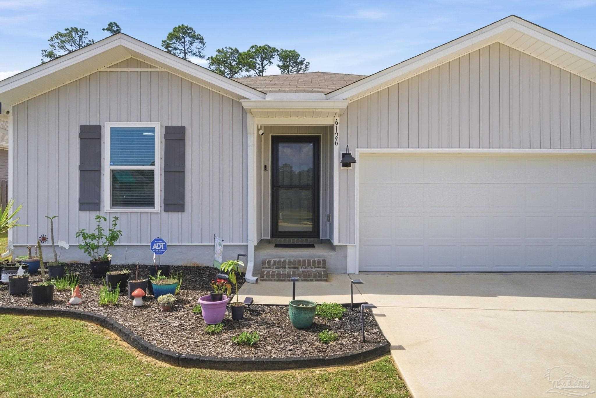 6126 Native Dancer Way Pensacola, FL 32526 - Photo 5 of 40 a view of a house with outdoor space