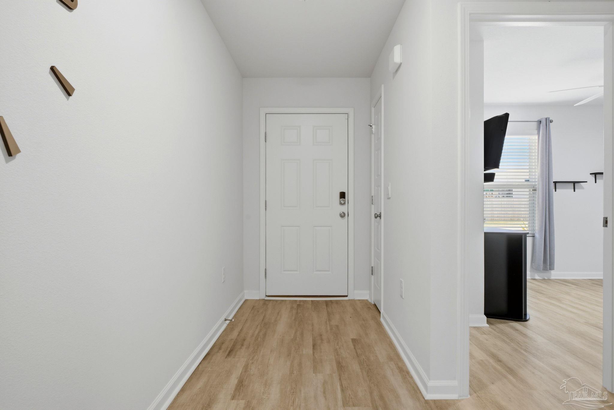 6126 Native Dancer Way Pensacola, FL 32526 - Photo 6 of 40 a view of a room with wooden floor