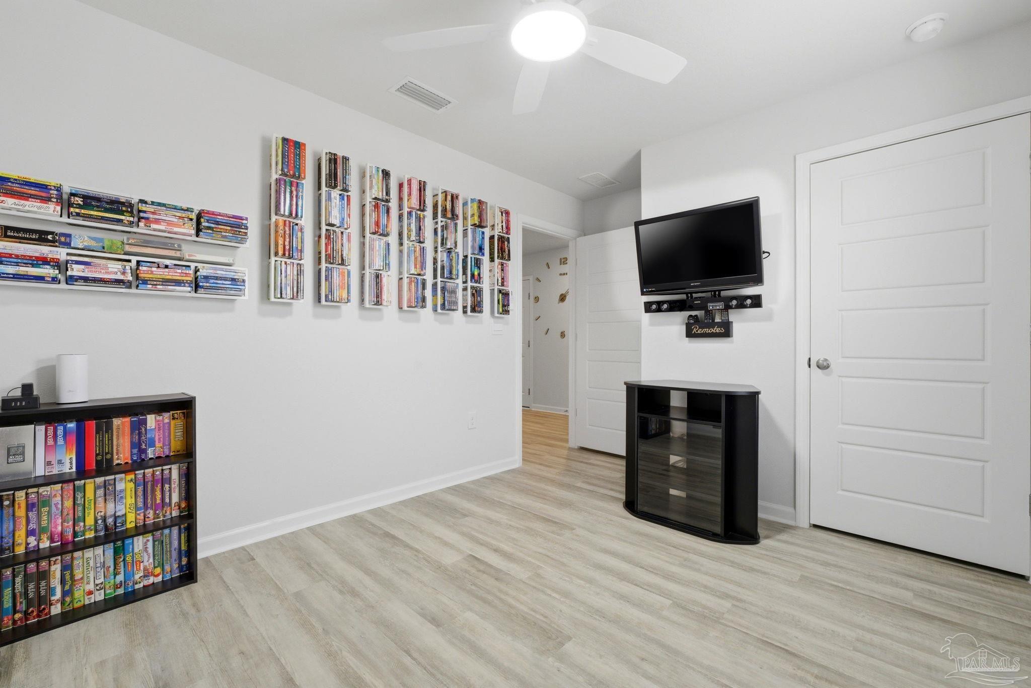 6126 Native Dancer Way Pensacola, FL 32526 - Photo 8 of 40 a view of a livingroom with furniture and a flat screen tv