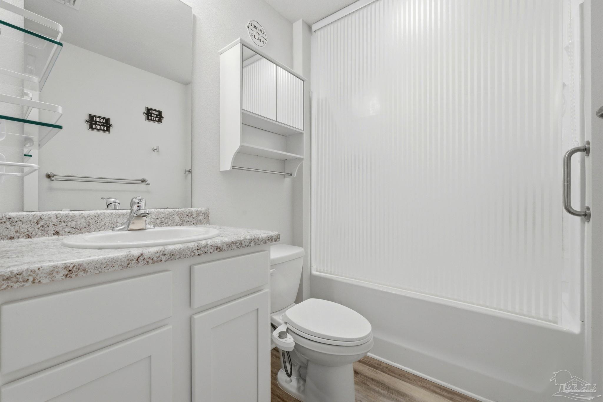 6126 Native Dancer Way Pensacola, FL 32526 - Photo 9 of 40 a bathroom with a granite countertop sink toilet and shower