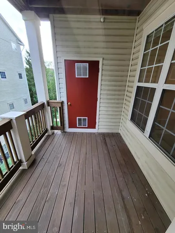 a view of deck with wooden floor and fence