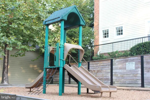 a view of a balcony with floor to ceiling windows with yard