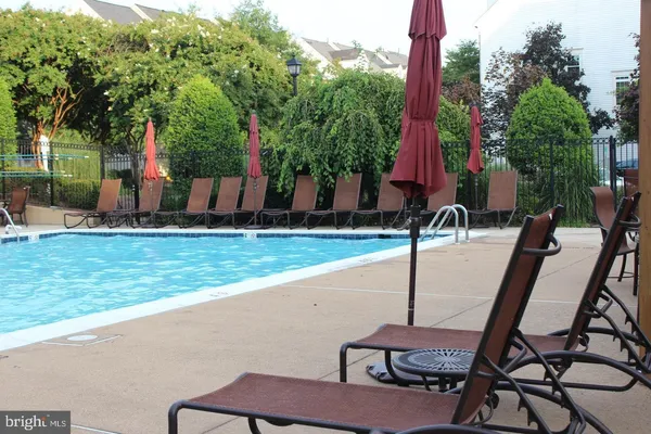 a view of a backyard with sitting area