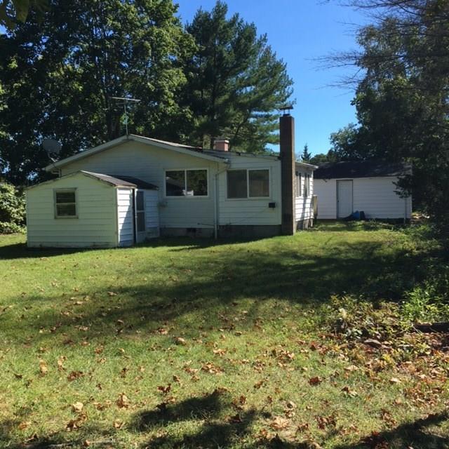 830 Boston Post Road Westbrook, CT 06498 - Photo 1 of 1 a front view of a house with a garden