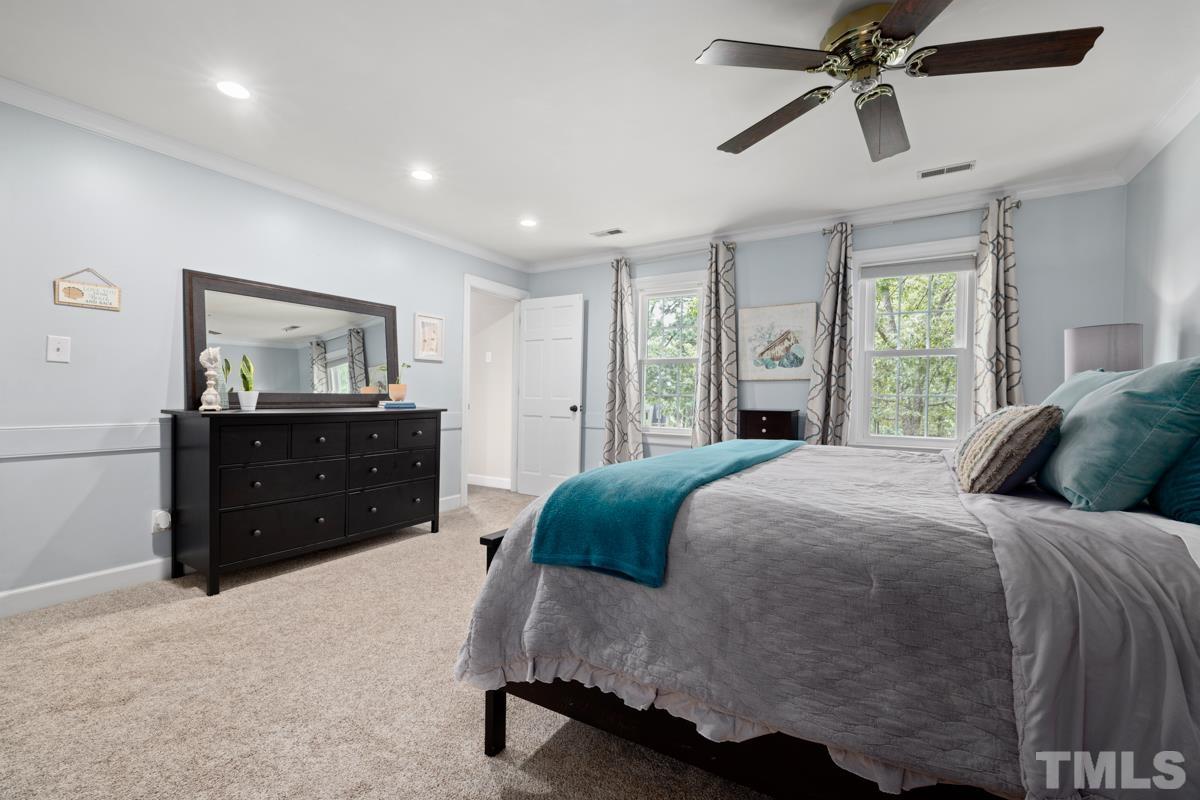 8804 Audley Circle Raleigh, NC 27615 - Photo 20 of 54 a bedroom with a bed and a dresser