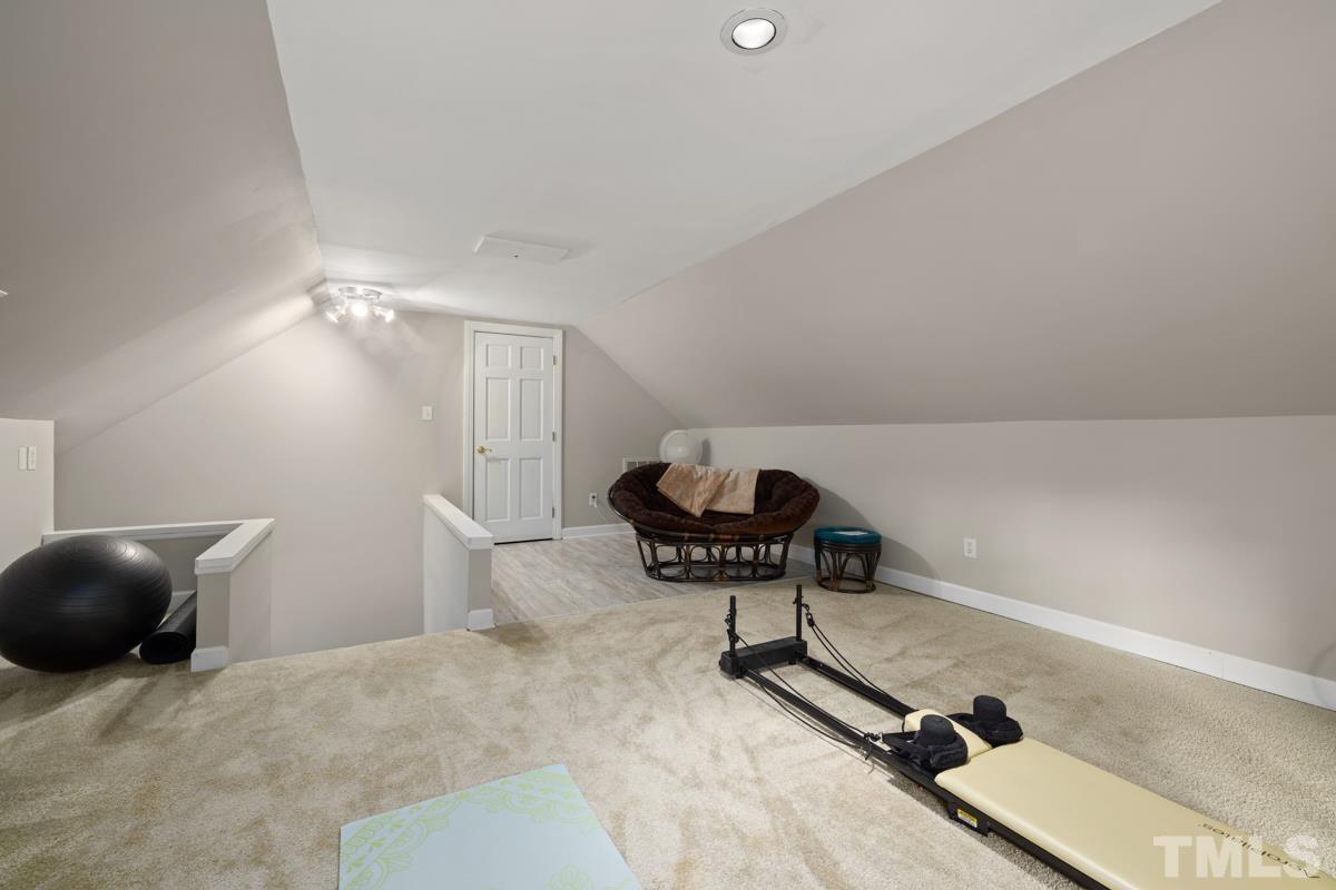 8804 Audley Circle Raleigh, NC 27615 - Photo 26 of 54 a living room with furniture and a chandelier