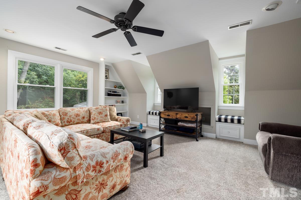 8804 Audley Circle Raleigh, NC 27615 - Photo 32 of 54 a living room with furniture and a flat screen tv