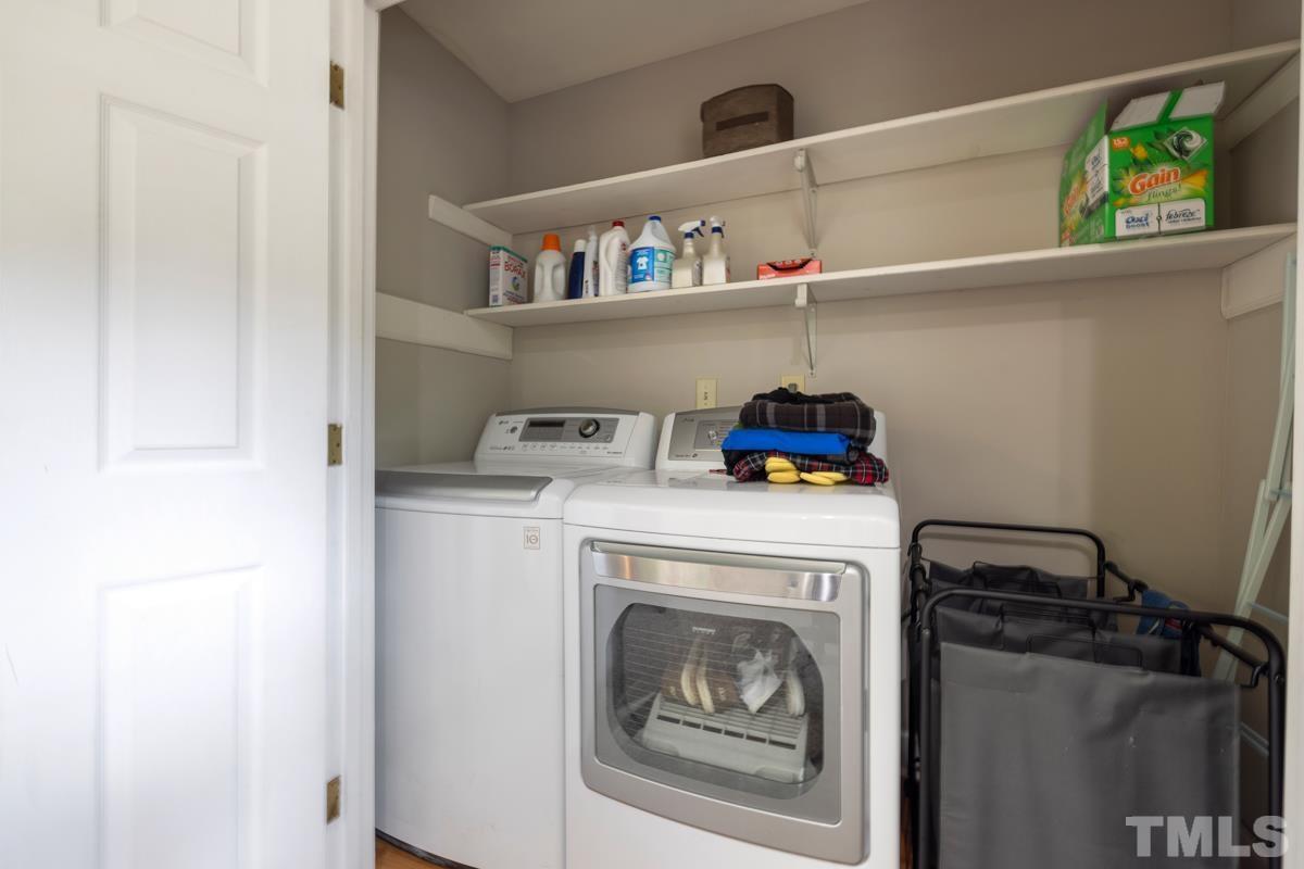 8804 Audley Circle Raleigh, NC 27615 - Photo 34 of 54 a utility room with dryer and washer