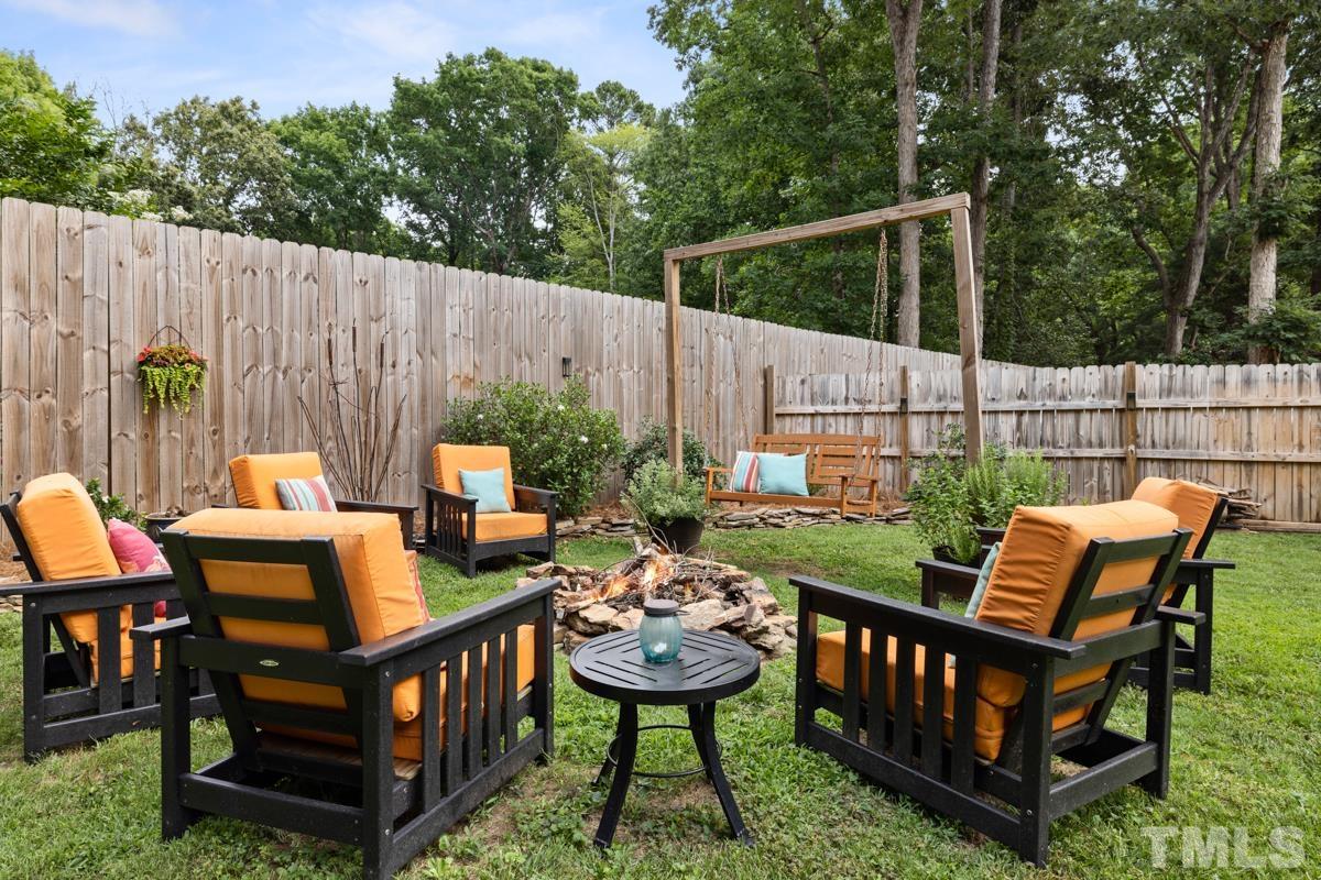 8804 Audley Circle Raleigh, NC 27615 - Photo 39 of 54 a backyard of a house with barbeque oven and outdoor seating
