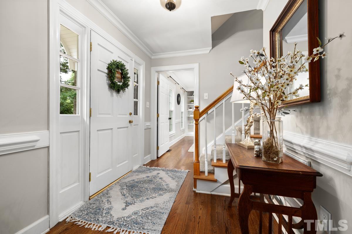 8804 Audley Circle Raleigh, NC 27615 - Photo 4 of 54 a view of entryway and hall with wooden floor