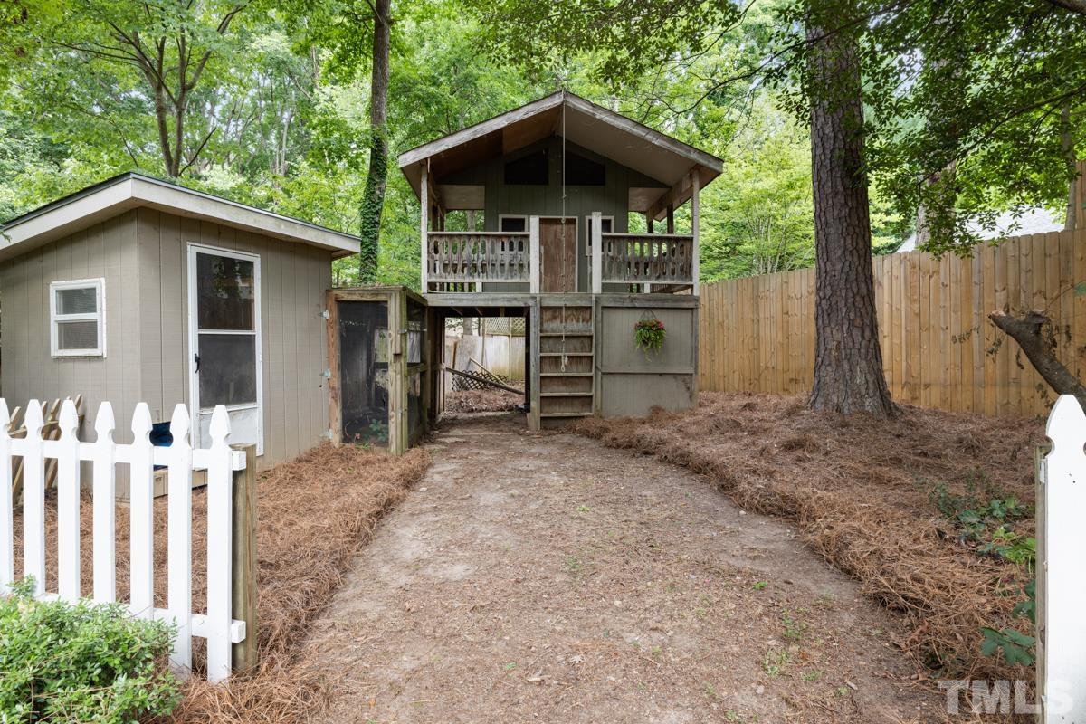 8804 Audley Circle Raleigh, NC 27615 - Photo 42 of 54 a view of a house with a yard and wooden fence