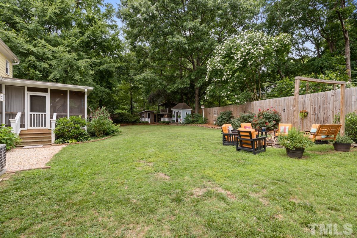 8804 Audley Circle Raleigh, NC 27615 - Photo 44 of 54 a view of a backyard with sitting area and slide