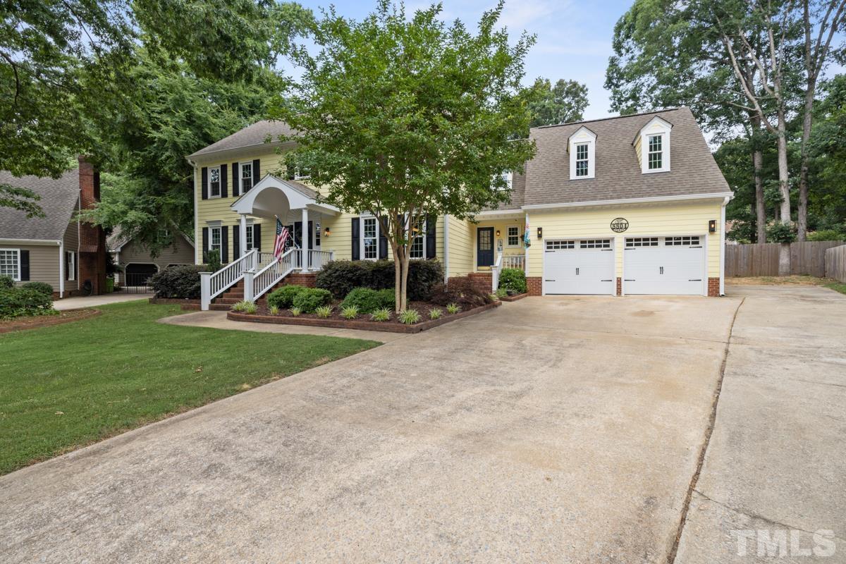 8804 Audley Circle Raleigh, NC 27615 - Photo 47 of 54 a front view of a house with a yard and garage