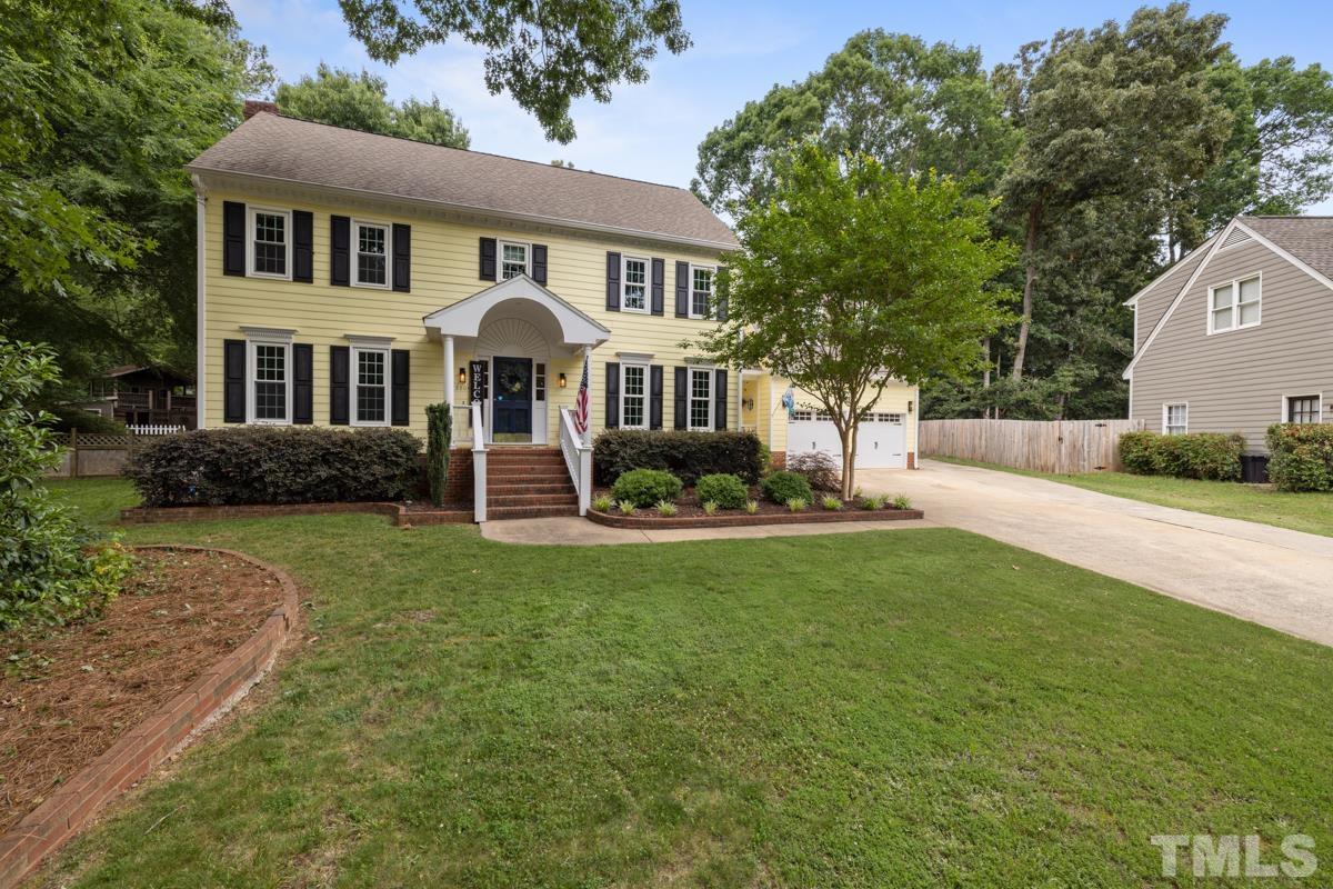8804 Audley Circle Raleigh, NC 27615 - Photo 48 of 54 a front view of a house with garden