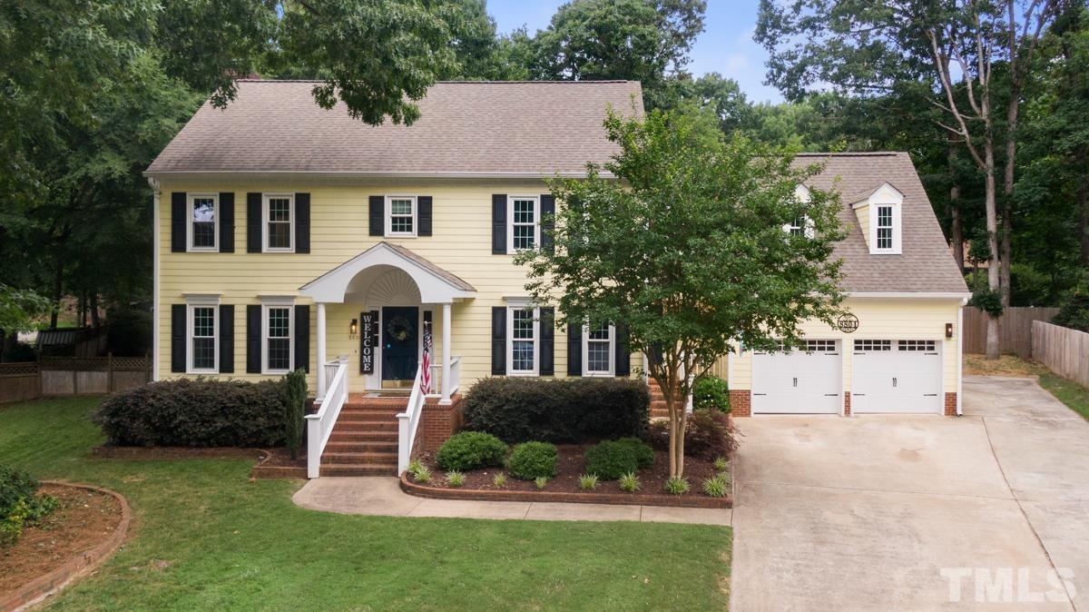 8804 Audley Circle Raleigh, NC 27615 - Photo 50 of 54 a front view of a house with a yard and trees