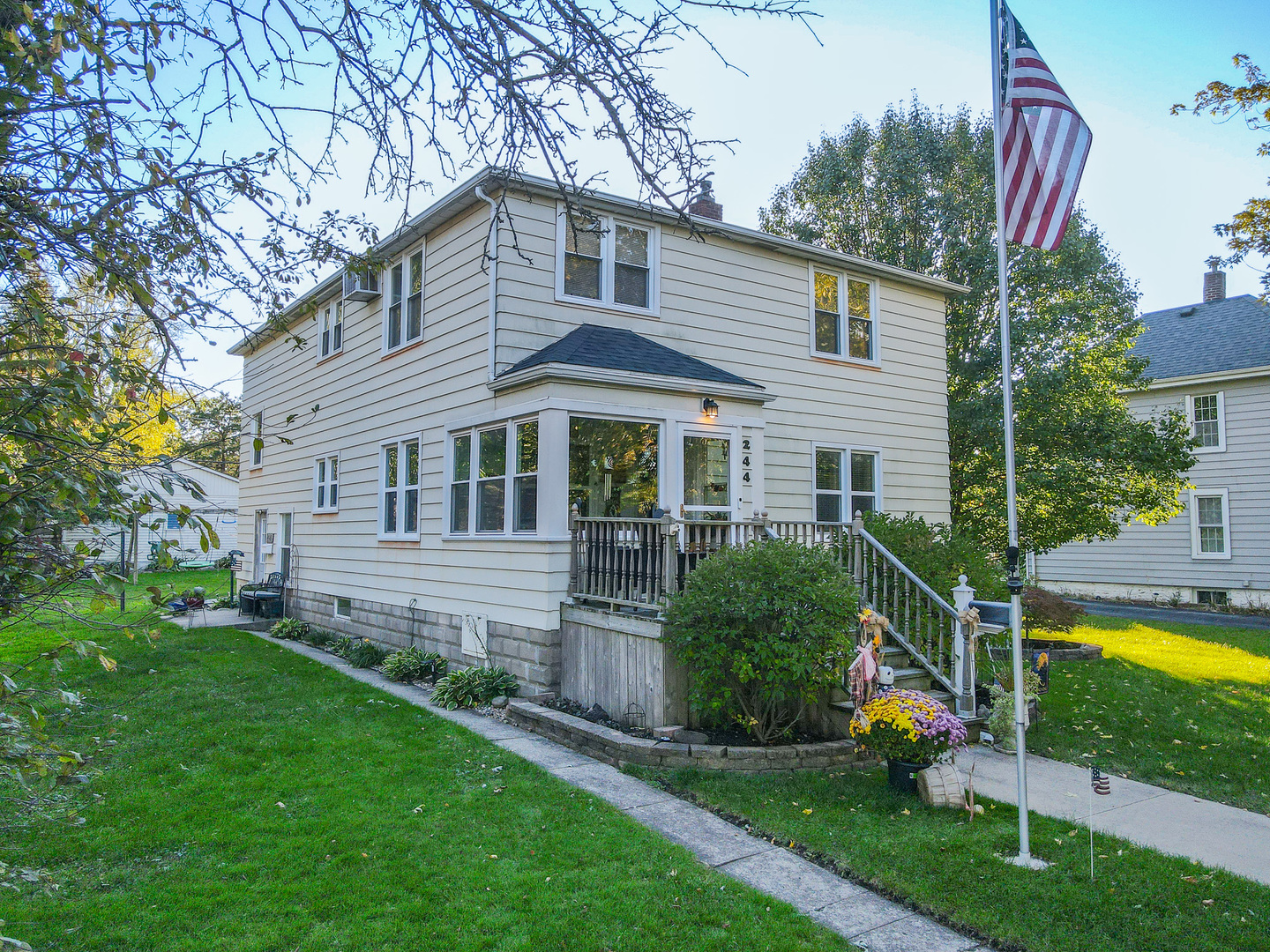 a front view of house with yard and green space