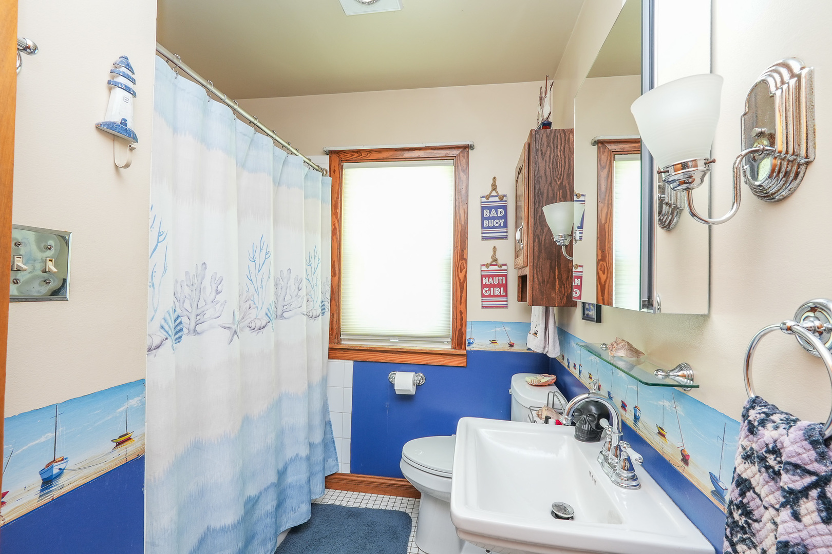 244 West 4th Street Manteno, IL 60950 - Photo 11 of 42 a bathroom with a sink and a mirror