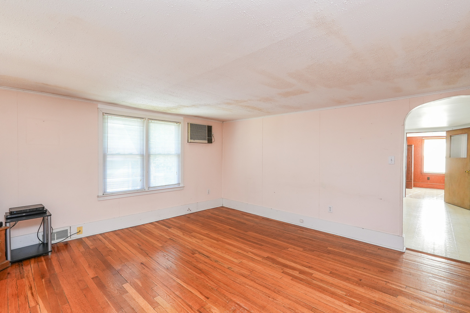 244 West 4th Street Manteno, IL 60950 - Photo 26 of 42 an empty room with wooden floor and windows