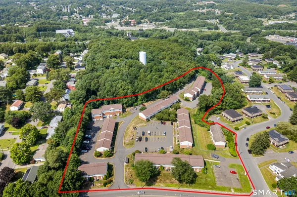 an aerial view of residential houses with outdoor space