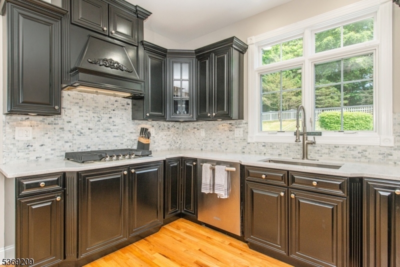 6 Perin Place Succasunna, NJ 07876 - Photo 11 of 39 a kitchen with granite countertop a sink stove and cabinets