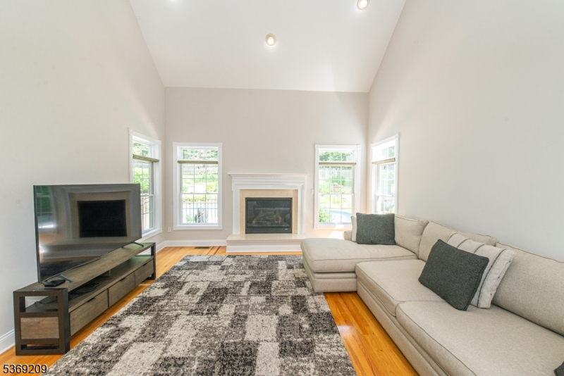 6 Perin Place Succasunna, NJ 07876 - Photo 13 of 39 a living room with furniture fireplace and flat screen tv