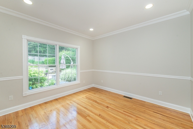 6 Perin Place Succasunna, NJ 07876 - Photo 18 of 39 wooden floor in an empty room with a window