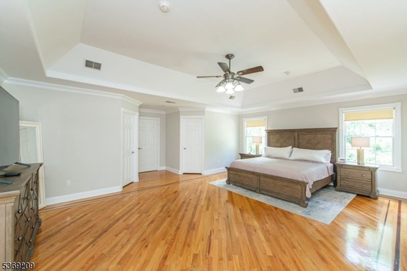 6 Perin Place Succasunna, NJ 07876 - Photo 20 of 39 a spacious bedroom with a bed and wooden floor