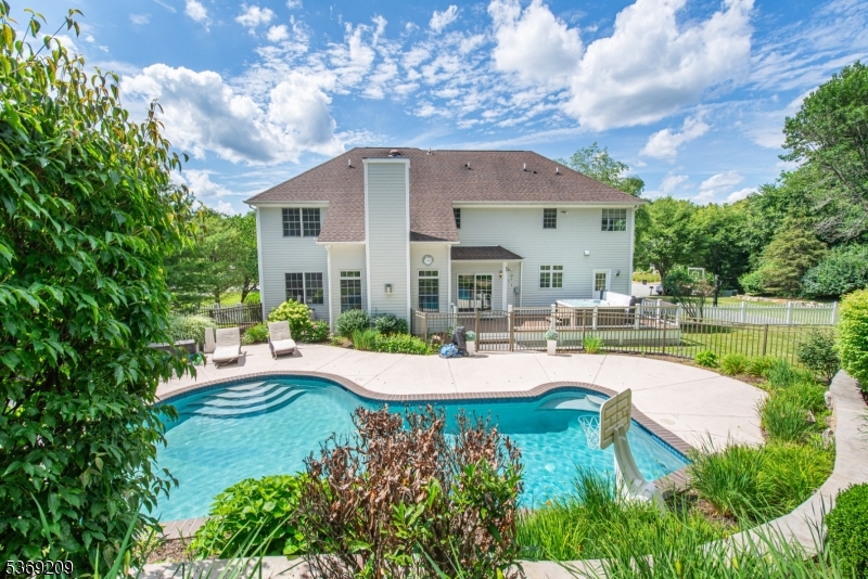 6 Perin Place Succasunna, NJ 07876 - Photo 2 of 39 a view of a house with swimming pool and sitting area