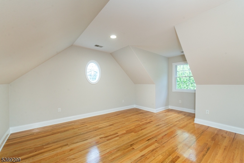 6 Perin Place Succasunna, NJ 07876 - Photo 24 of 39 an empty room with wooden floor and windows
