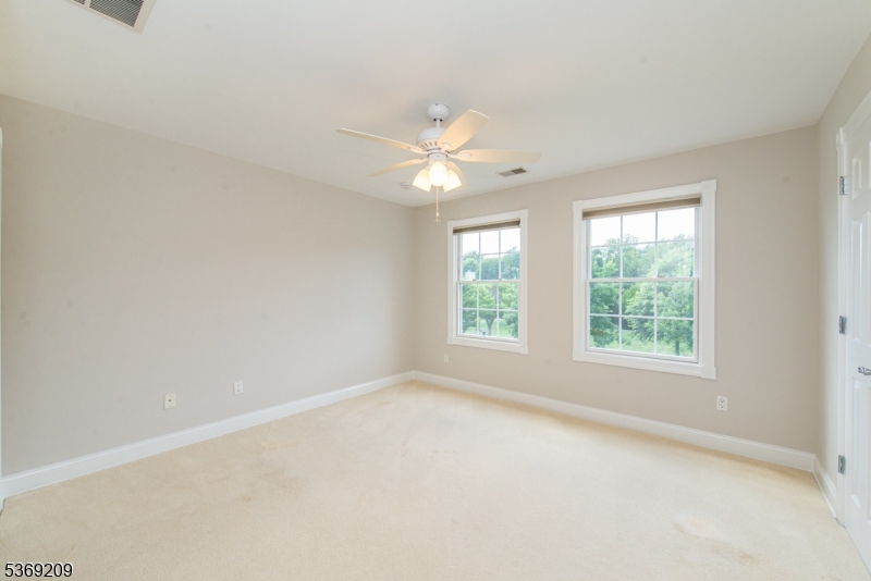 6 Perin Place Succasunna, NJ 07876 - Photo 26 of 39 an empty room with a window and a fan