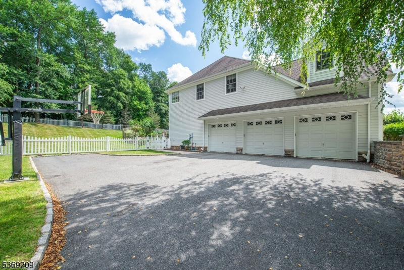 6 Perin Place Succasunna, NJ 07876 - Photo 36 of 39 a view of a house with a yard and a large tree