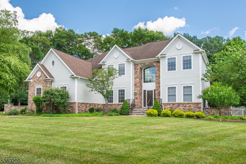 6 Perin Place Succasunna, NJ 07876 - Photo 38 of 39 a front view of a house with a yard and green space