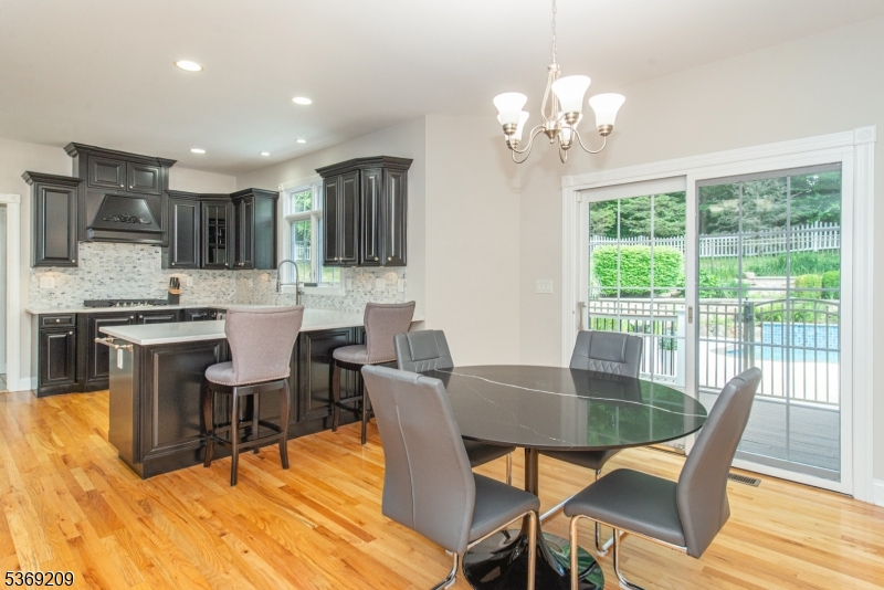 6 Perin Place Succasunna, NJ 07876 - Photo 7 of 39 a dining room filled chandelier and wooden floor