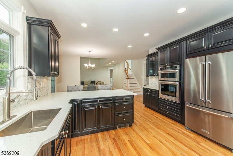 6 Perin Place Succasunna, NJ 07876 - Photo 9 of 39 a large kitchen with stainless steel appliances granite countertop a sink stove and refrigerator