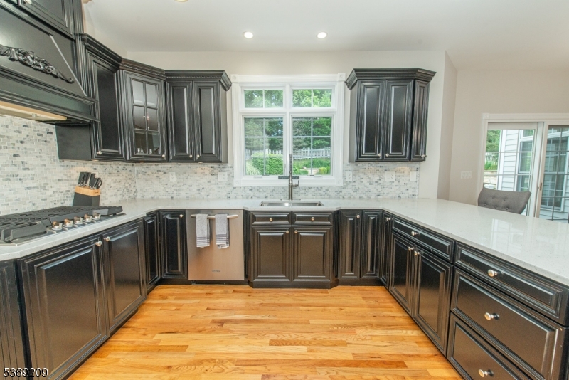 6 Perin Place Succasunna, NJ 07876 - Photo 10 of 39 a kitchen with stainless steel appliances granite countertop a sink and stove