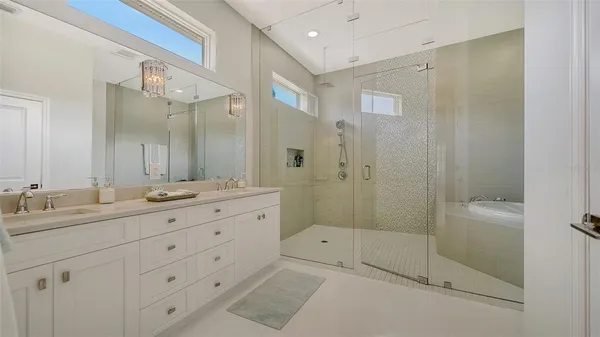 a view of a backyard with table and chairs under an umbrella
