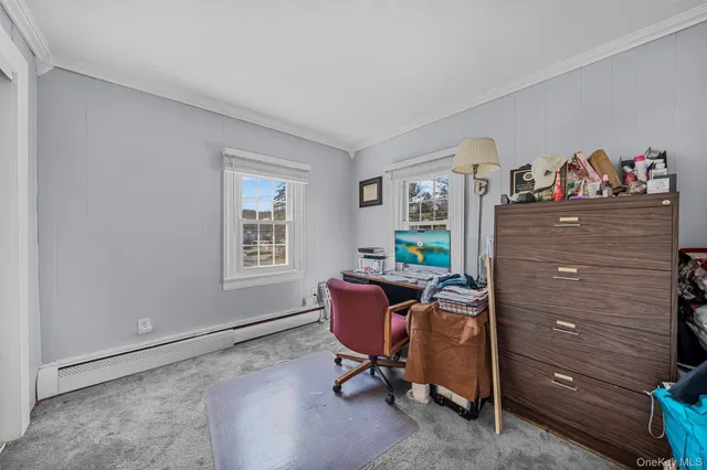 a room with chair and a window